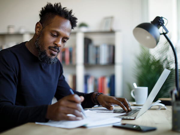 Find a Lawyer Man researching and taking notes