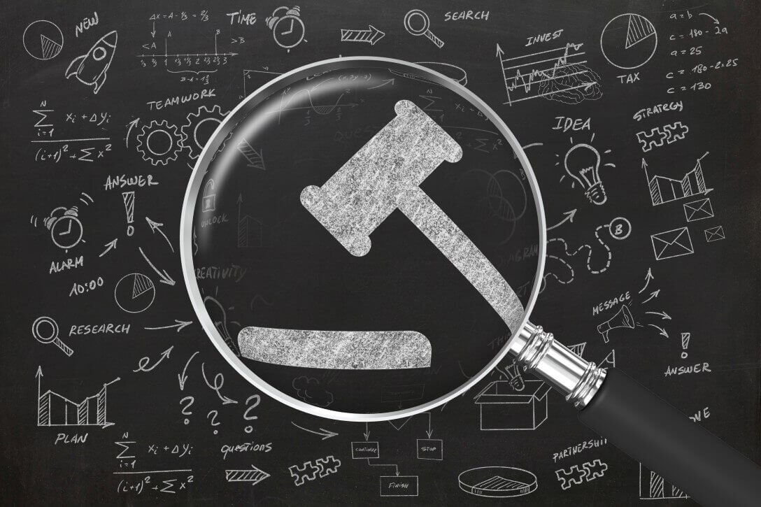 Magnifying glass viewing gavel and block sketch