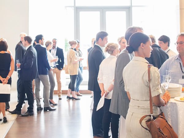 Attendees networking at a conference